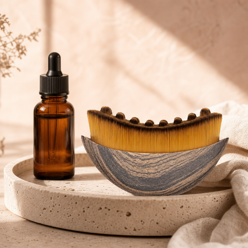 Lumëa Sculpt Brush on a stone tray with facial oil